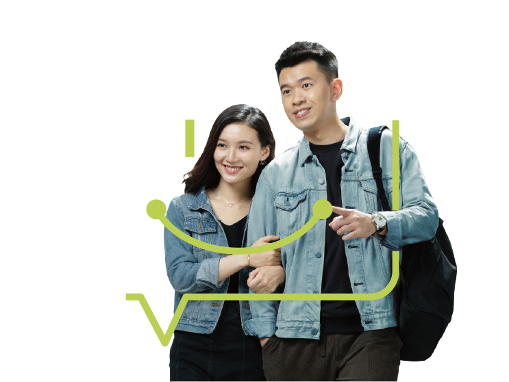Young couple walking in front of a branch of Hang Seng Bank